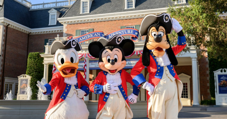 Donald Duck, Mickey Mouse, and Goofy dressed in patriotic outfits in the American Adventure pavilion in EPCOT