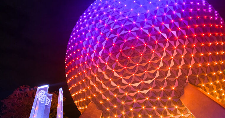 Spaceship Earth lit at EPCOT in Walt Disney World at nighttime.