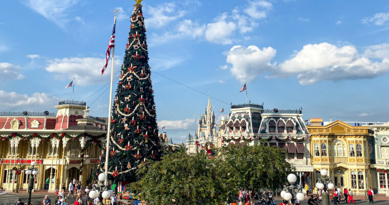 Cinderella Castle and Main Street, U.S.A. at Magic Kingdom in Walt Disney World with Christmas tree during holiday season.
